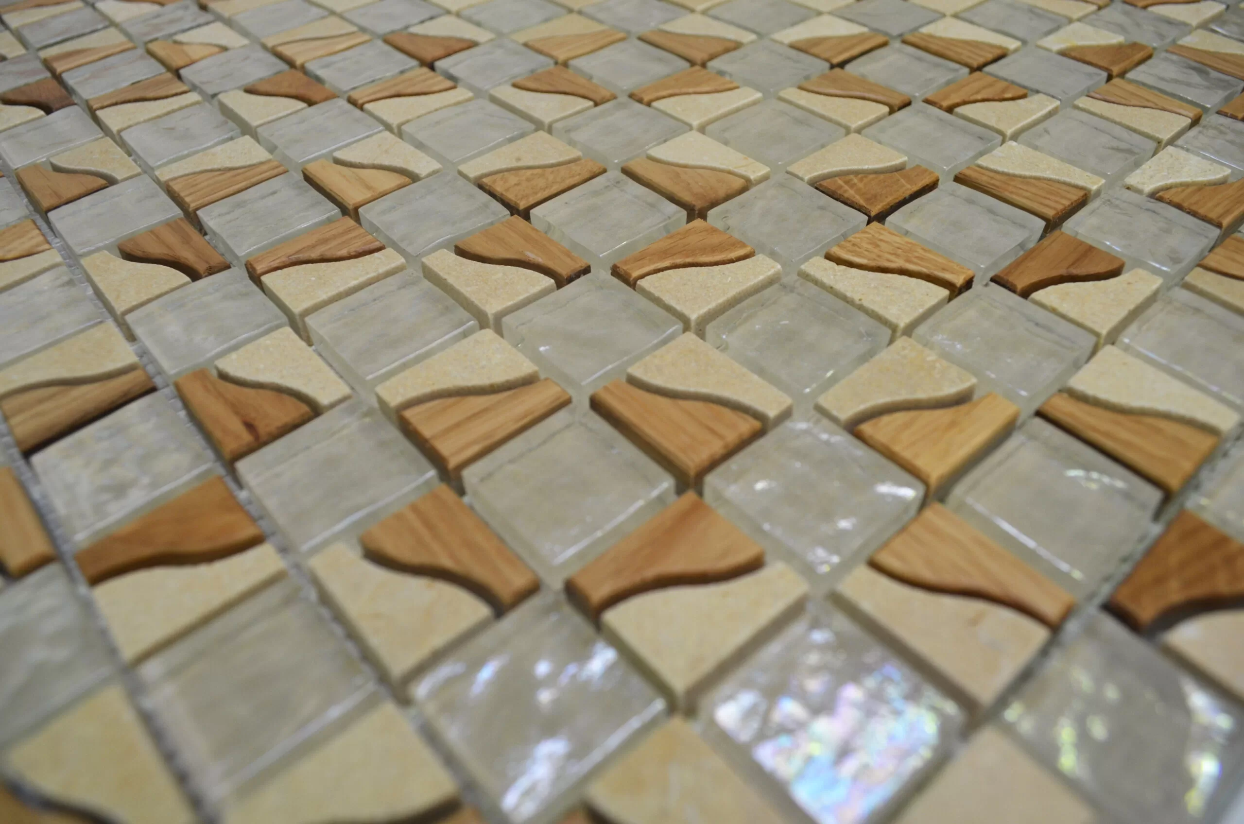 Bleached Oak Hardwood mosaic comprising bevelled square chips 8 mm thick, in size 23x23 and 23x48 mm, mounted on glass fibre mesh to form a sheet of 300x300 mm in which the chips are about 2.2 mm apart. 